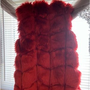 Women size XL faux fur red vest. Only worn once, in perfect condition
